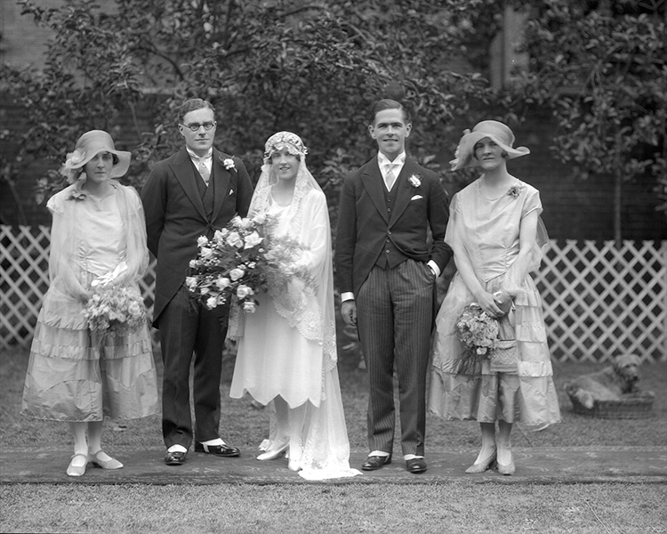 The marriage of George Marston Haddock to Miss Joan Pauline Bacon, wedding group with best man and two bridesmaids. 