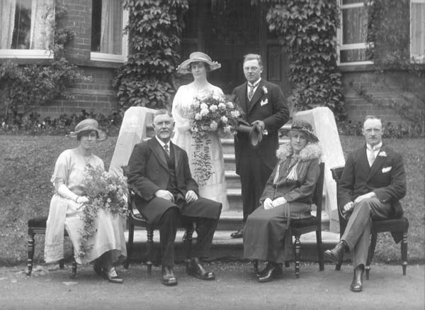 The marriage of Joshua (Joe) Hatrick to Miss Mary Roberta Morrow, wedding group with best man, bridesmaid and [probably] parents of the bride. 