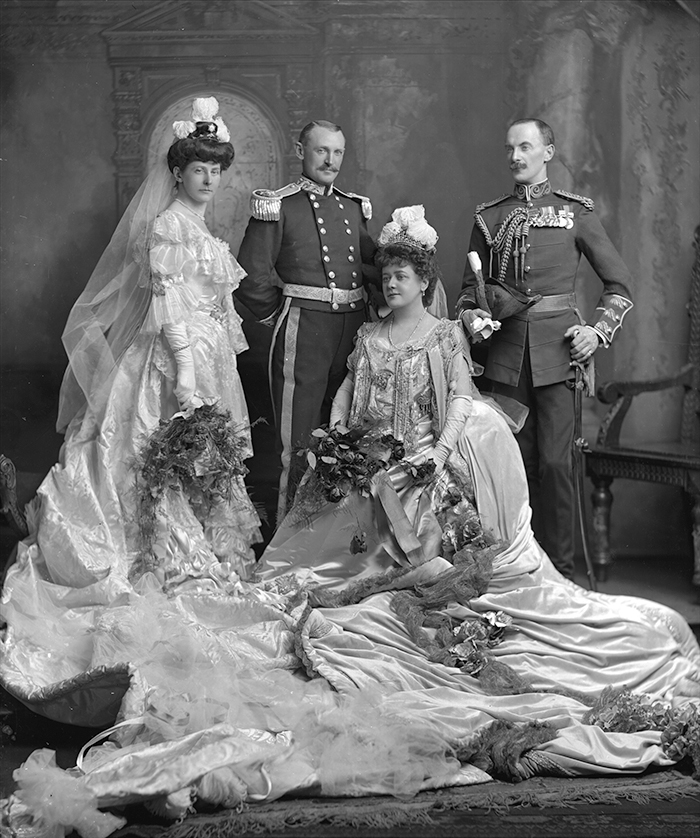 Mrs Lewis Anstruther Hope, née Lucy Palmer; daughter of George Palmer MP, a founder of Huntly and Palmers; m. (1887) Col. Lewis Anstruther Palmer. (Court Dress). Sir Walter Palmer, 1st Bart (1858-1910); 3rd son of George Palmer MP; Deputy Lieutenant for Berkshire; Conservative MP for Salisbury 1900-1906; Director of Huntly and Palmers, Ltd. (Deputy Lieutenant of Berkshire's Uniform). Lady Palmer, née Jean Craig (d. 1909); dau of William Young Craig MP; m. (1882) Sir Walter Palmer, 1st Bart. (Court Dress). Col. Lewis Anstruther Hope (1855-1929); ADC to King Edward VII. (Uniform of an ADC to the King). 