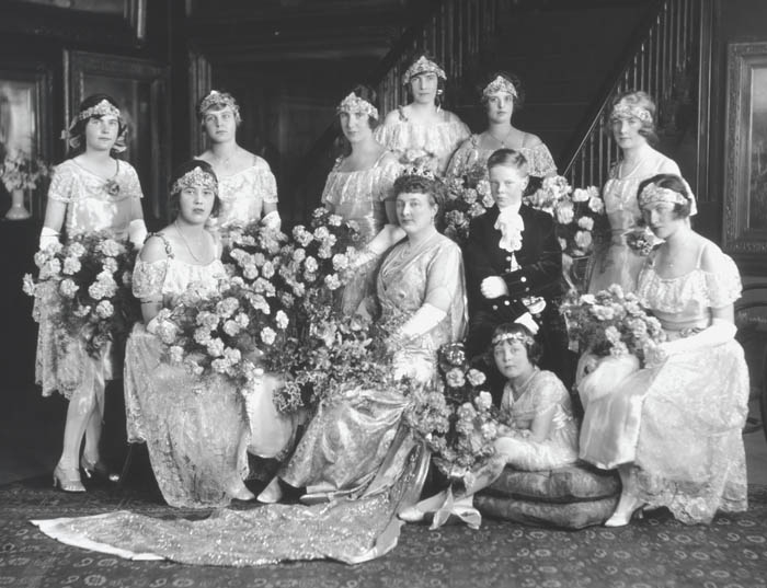 Mrs. Edward Cecil Moore, later Lady Moore, and since 1936 Mrs. George P.Warren, née Florence Mary Georgina Harveson (d. 1941), with Page and Maids of Honour. 